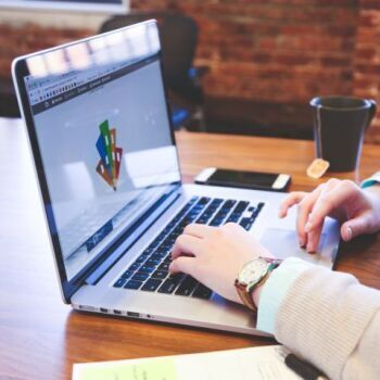 Person typing on computer